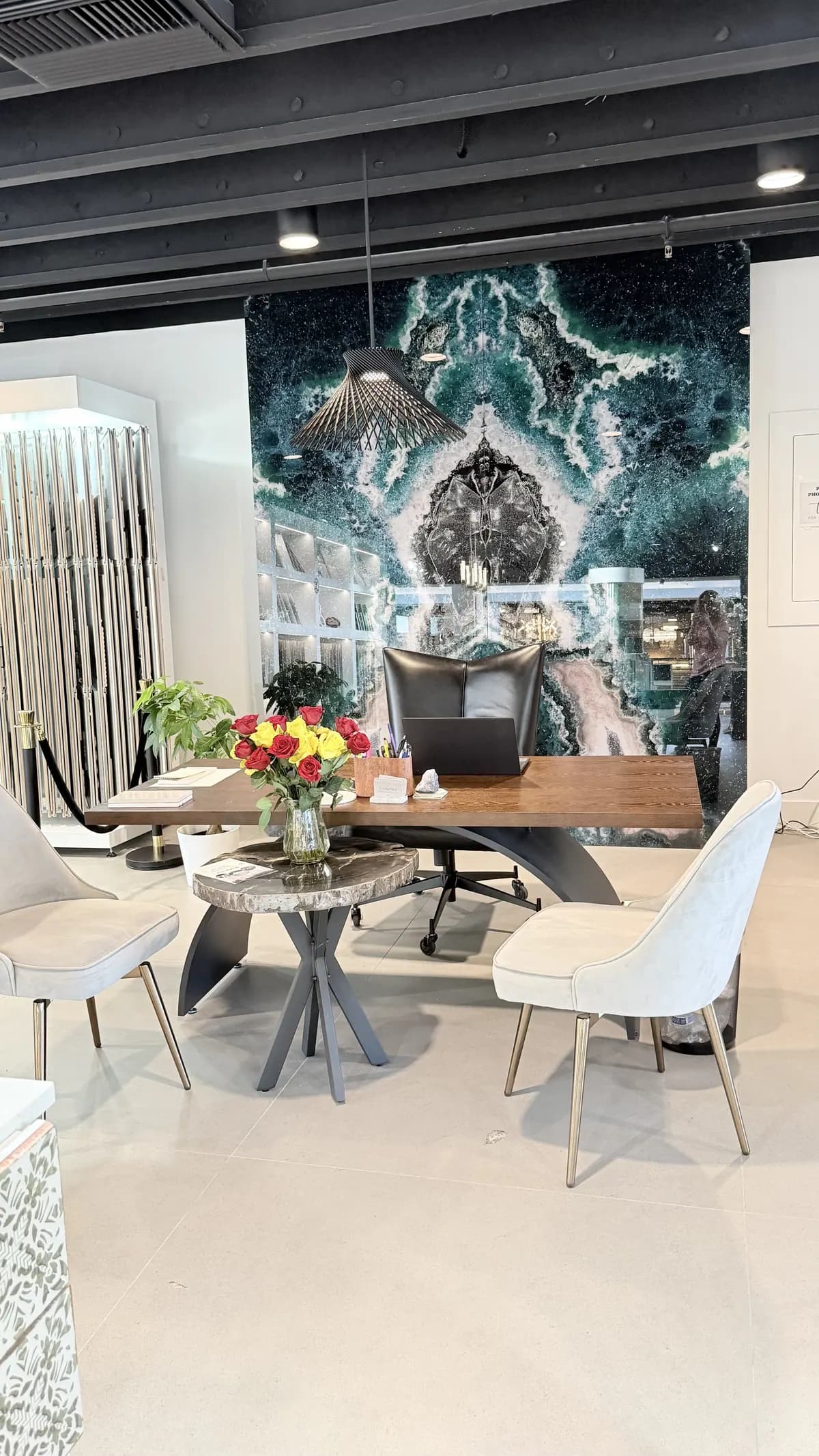 Slabs and display tables across the open showroom floor in Lomita